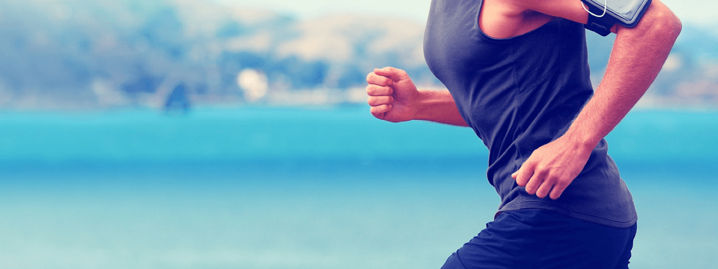 A person jogging with an phone strapped to their arm