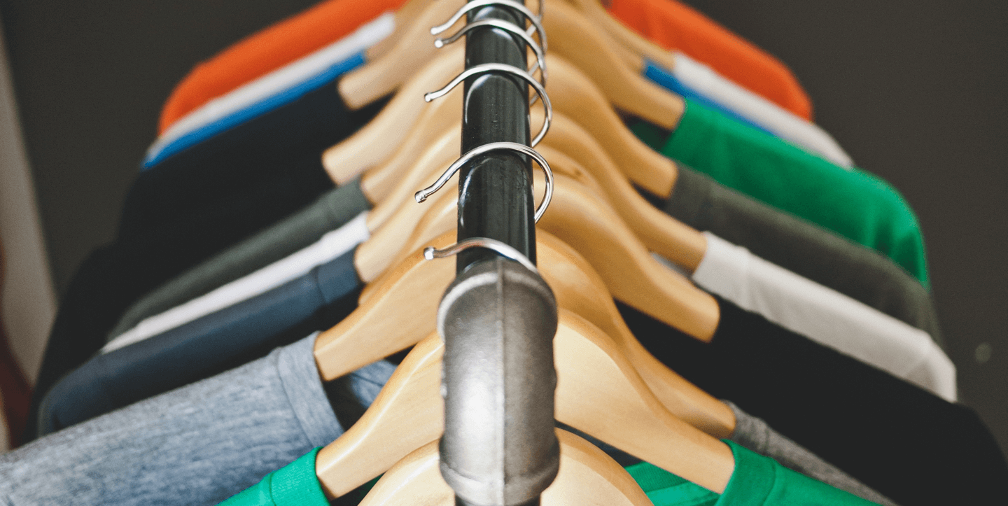 T-shirts hanging on a metal clothes rack