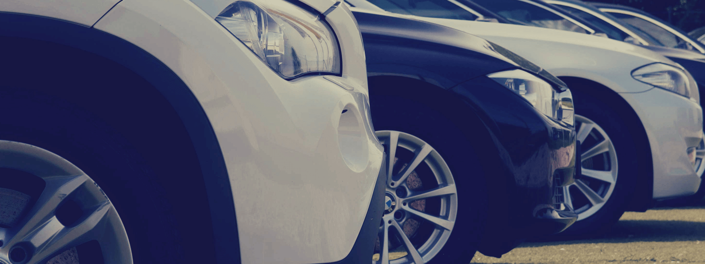 Closeup of several cars at a dealership