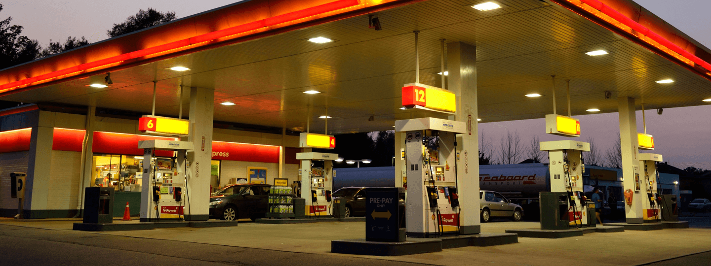 A view of a gas station at dusk