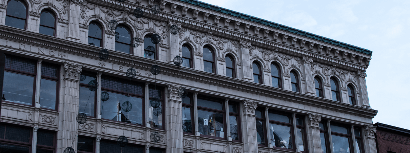 An old building with intricate detailing and glass windows