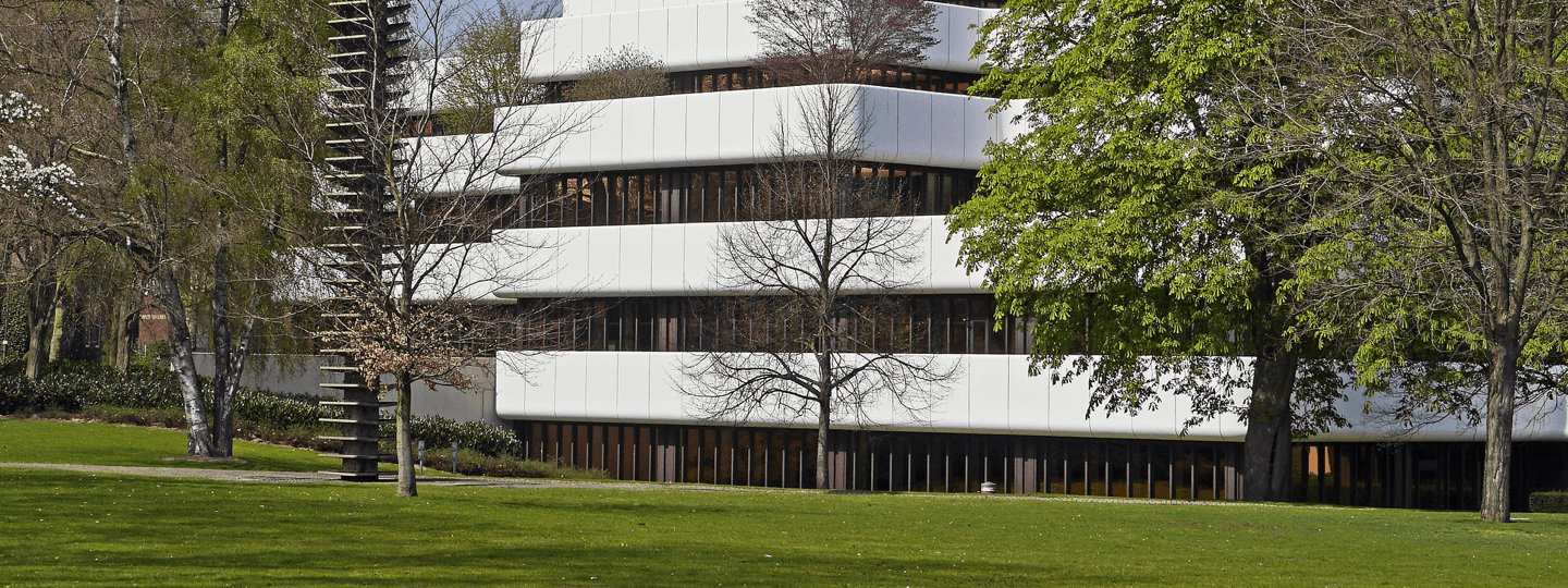 View of a suburban office complex from a large lawn