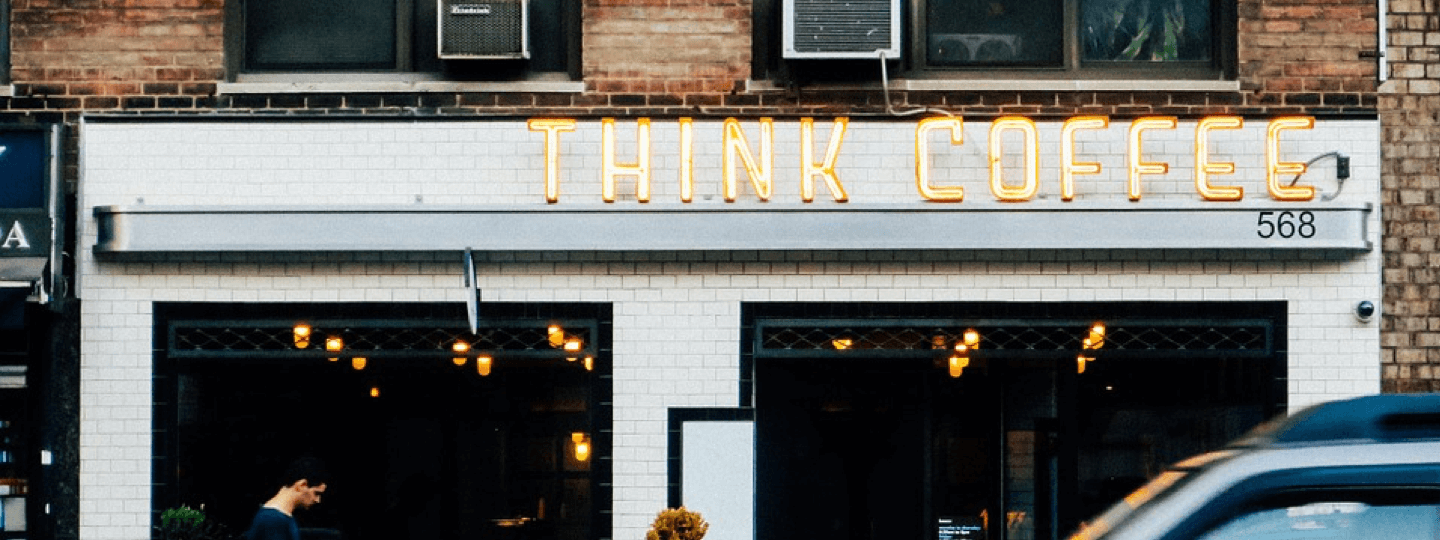 Think Coffee sign on a storefront