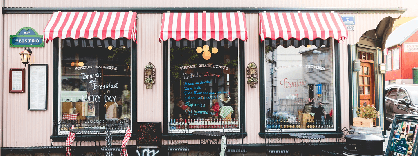 The front of a small bistro with outside seating