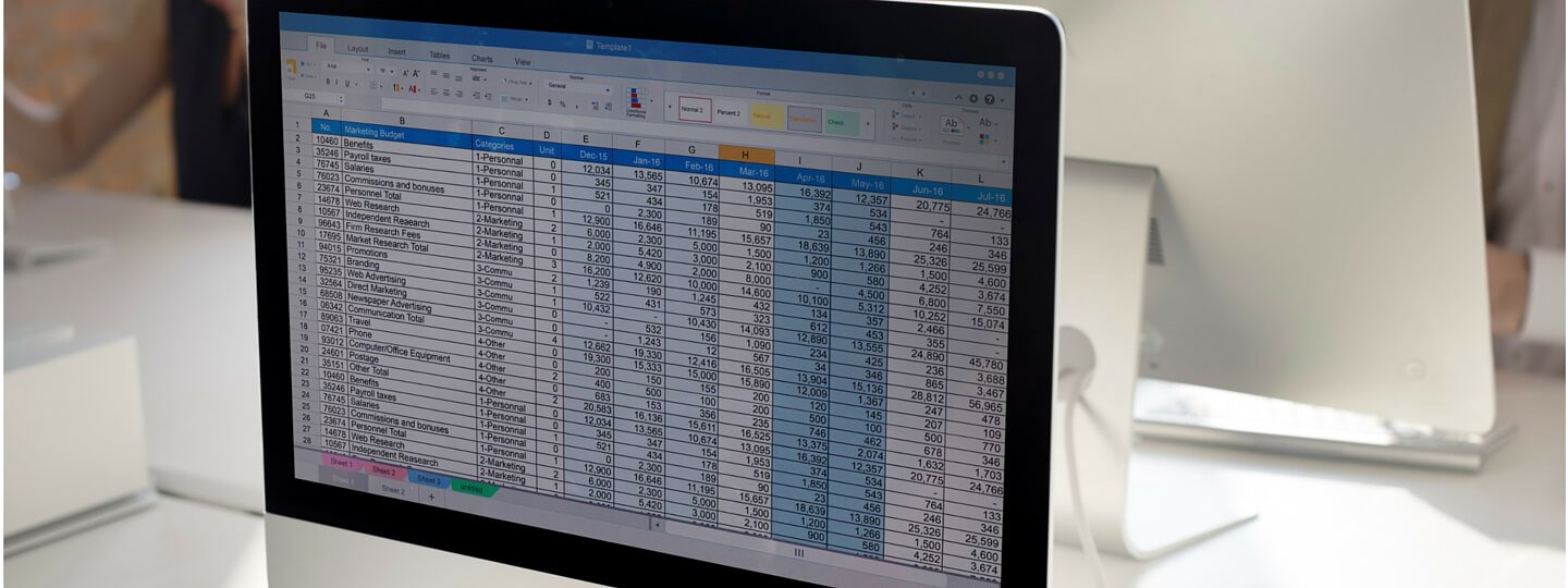 A computer monitor showing a spreadsheet with data