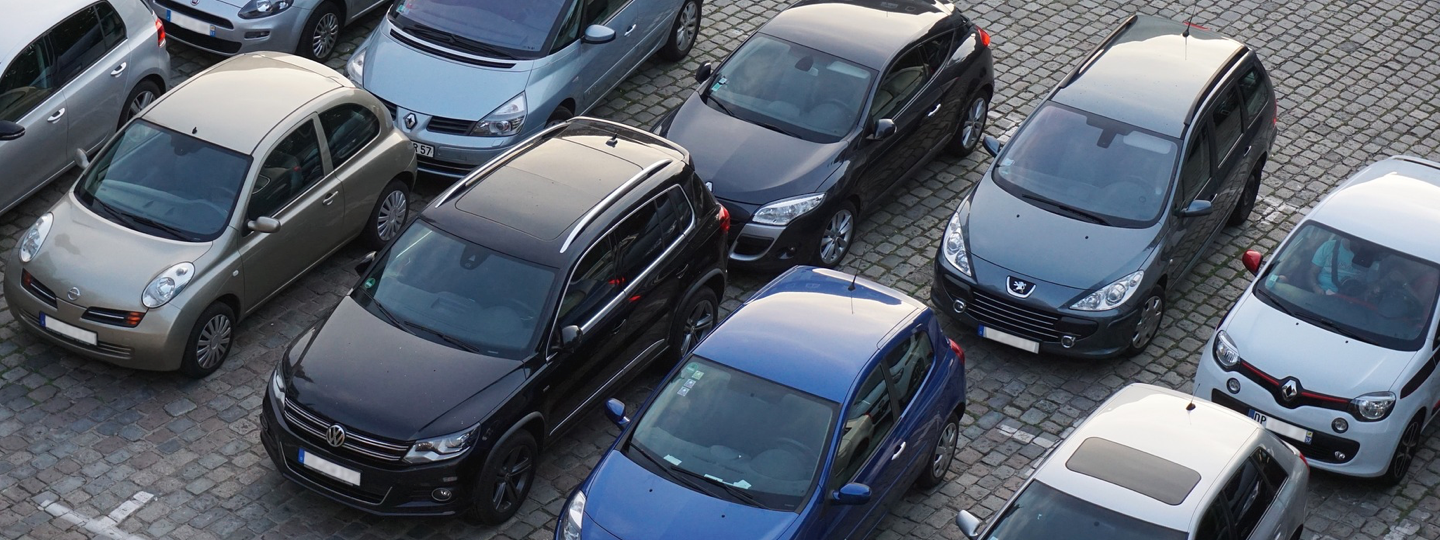 Several cars parked in a parking lot