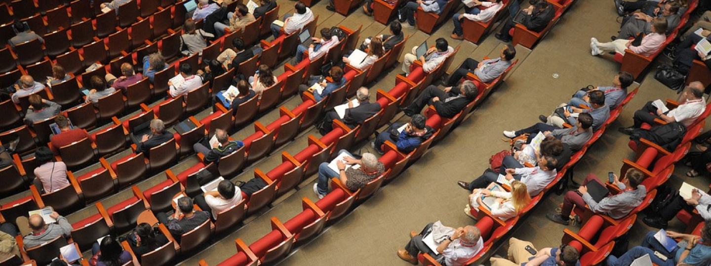 Top down view of people sitting in an auditorium