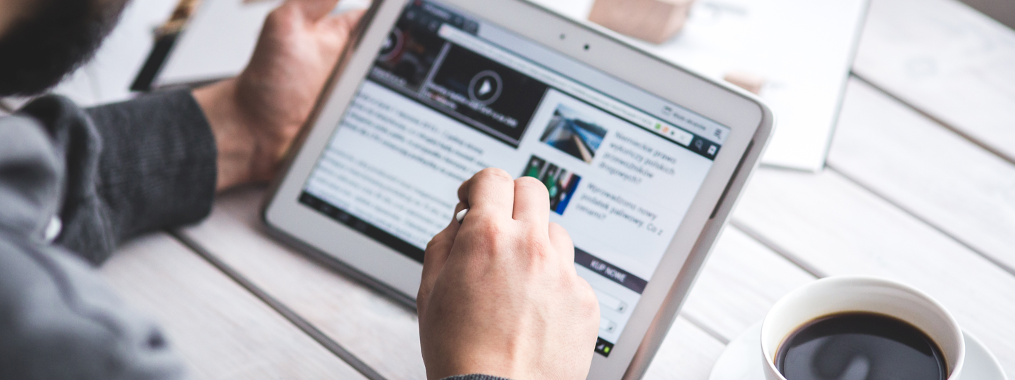 A person browsing the web on a tablet