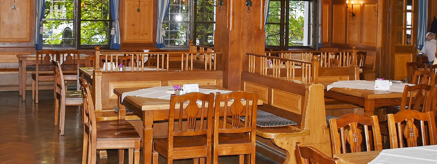 Inside of an older restaraunt dominated with wood decor