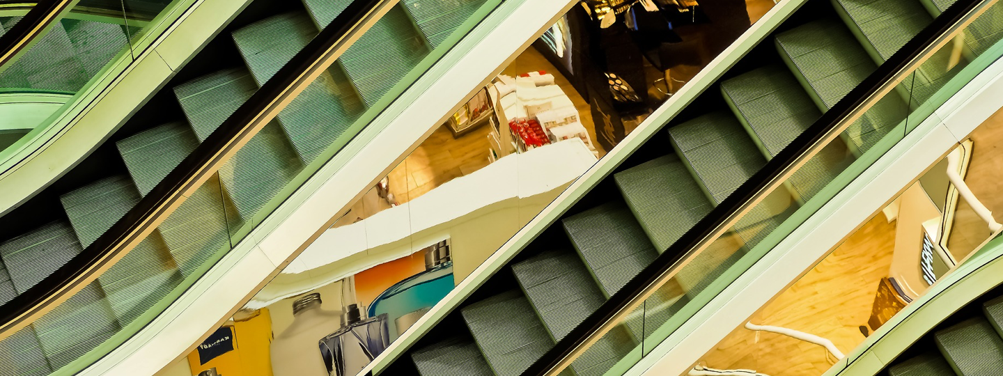 Looking down between escalators at a mall