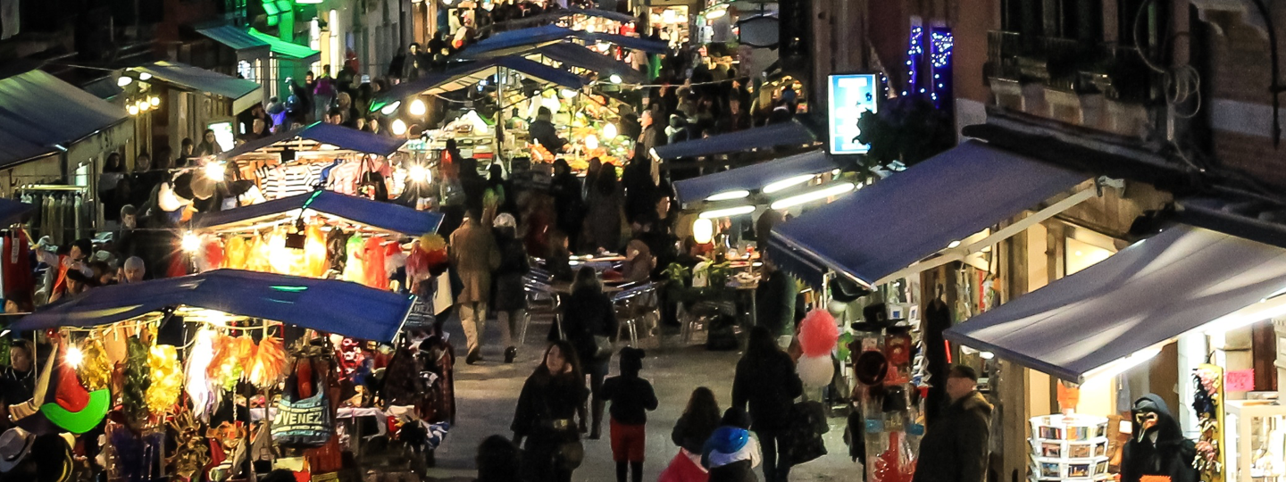 A crowded street fair at night