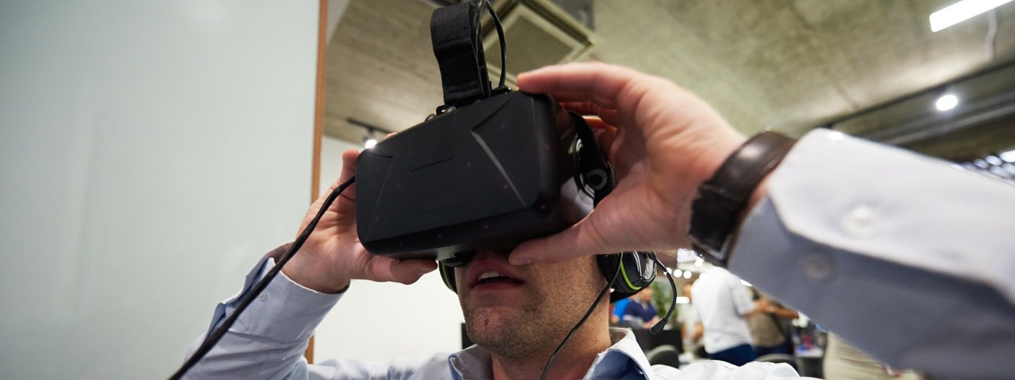 A man wearing virtual reality goggles