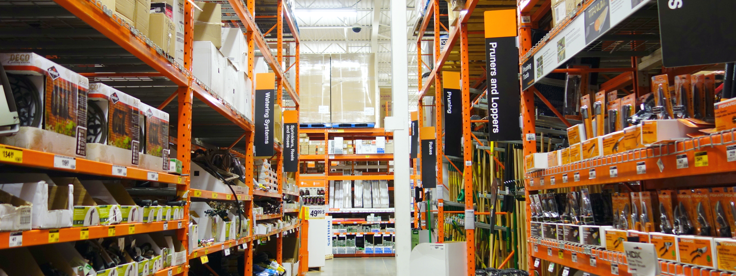 Rows of goods and equipment within a large home improvement store