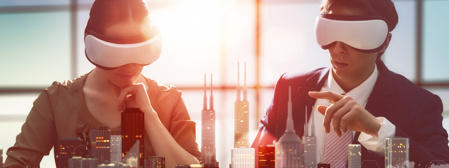 A female and male in VR goggles pointing at an overlayed city skyline