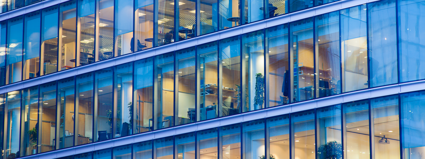 A glass facade showing the inside office space