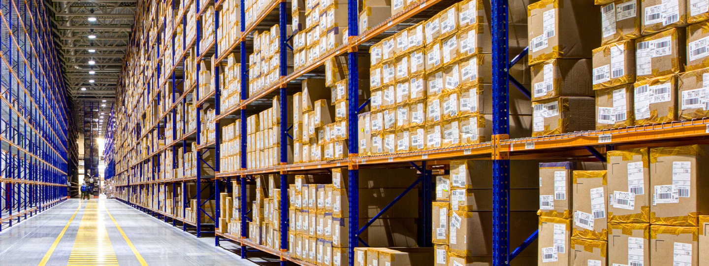 Thousands of boxes on shelves within a large warehouse