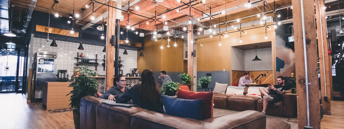 People inside a hip coffee shop with couches