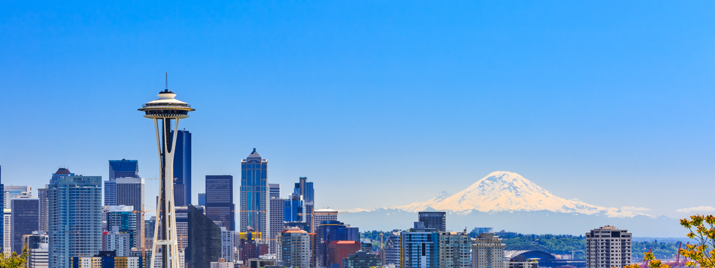 The Space Needle and the Seattle skyline with Mt. Rainier in the background