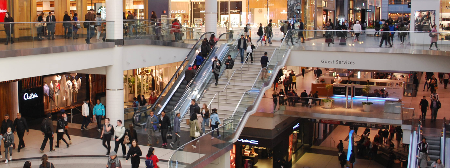 Interior view of a crowded, multi-story mall