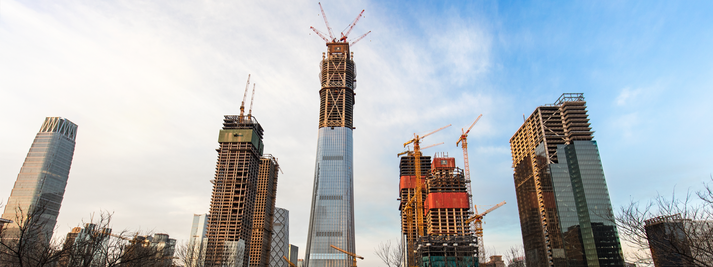 Several very tall office building under construction