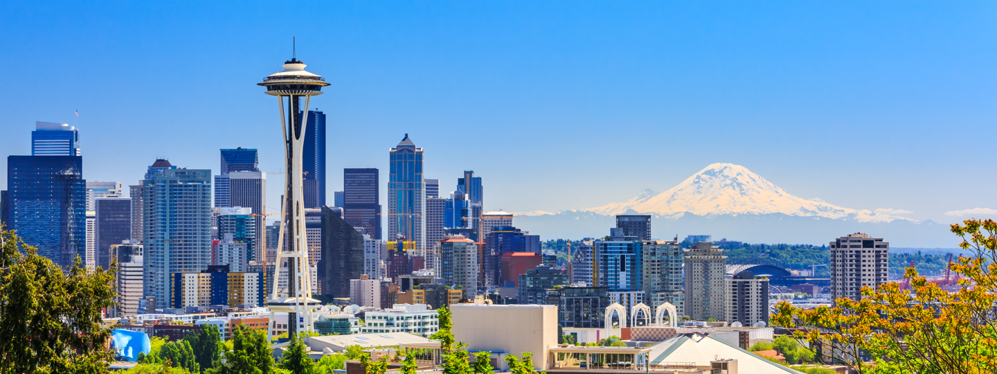 The Space Needle and the Seattle skyline with Mt. Rainier in the background