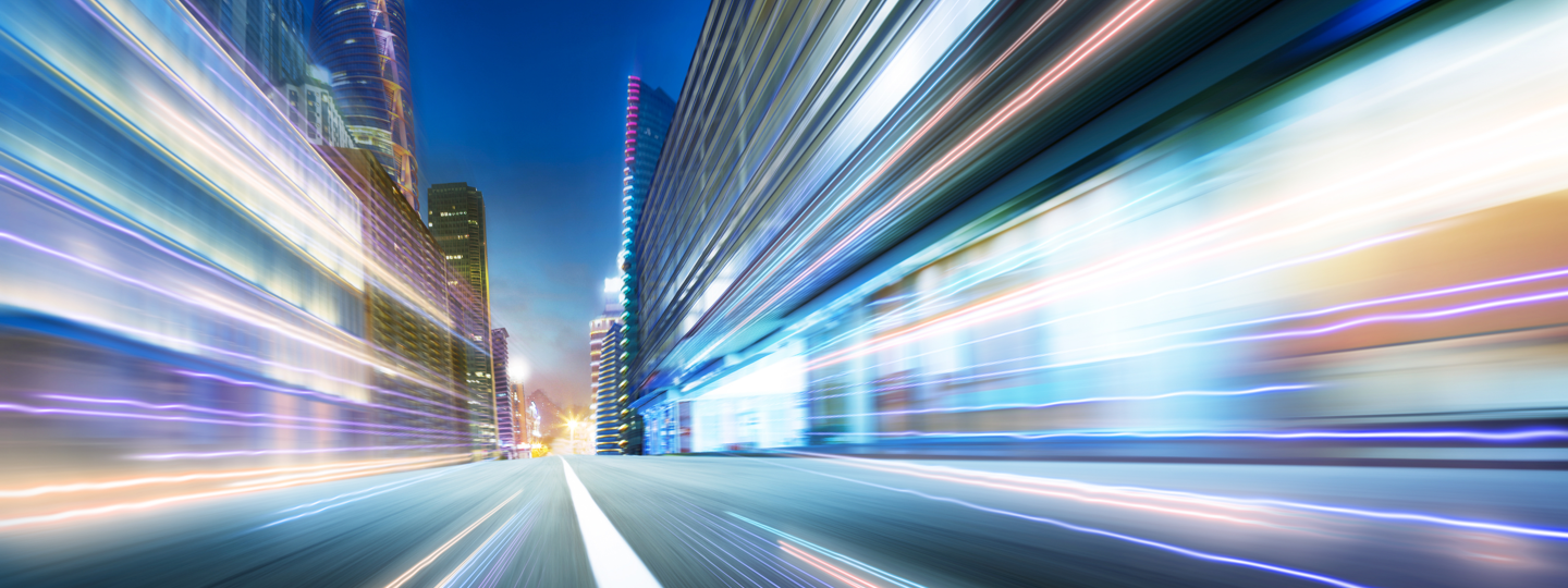 A long exposure with streaking lights of a city roadway