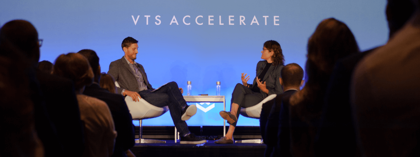 A male and female panelist in discussion at the VTS Accelerate conference